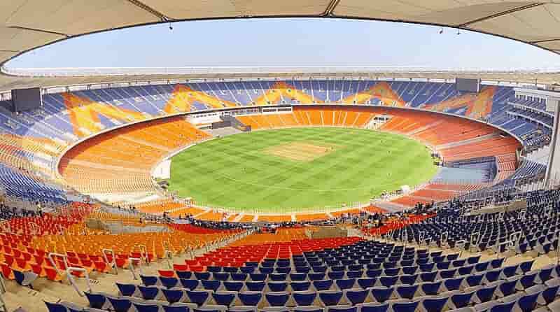2030 Commonwealth Games: भारत की बोली और तैयारी 2 “Ahmedabad Narendra Modi Stadium with Indian flag and 2030 Commonwealth Games bid celebration”